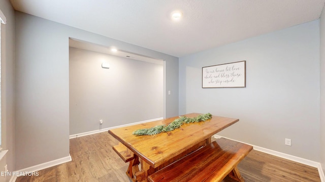 dining room with hardwood / wood-style floors