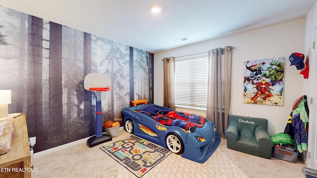 bedroom with carpet and a textured ceiling