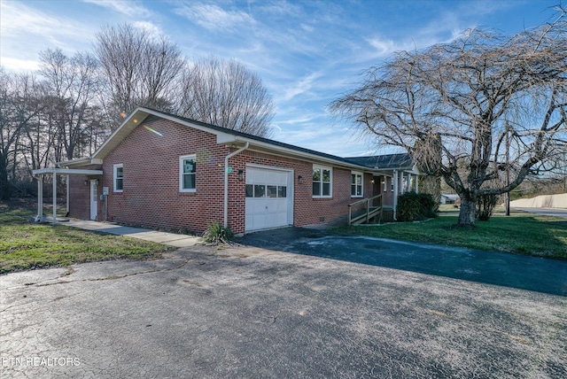 view of property exterior featuring a garage and a lawn