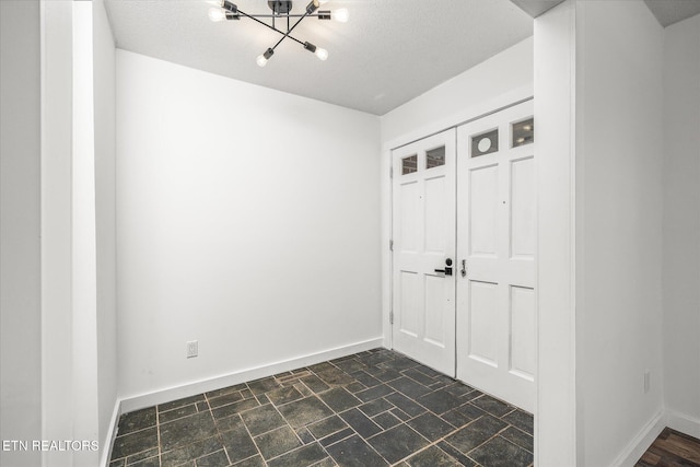 interior space with a textured ceiling