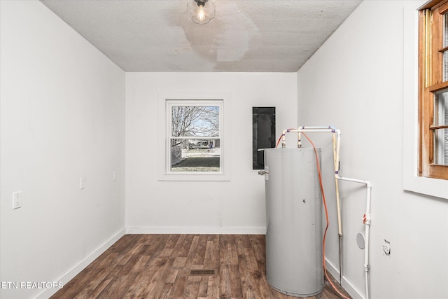 utility room with water heater and electric panel