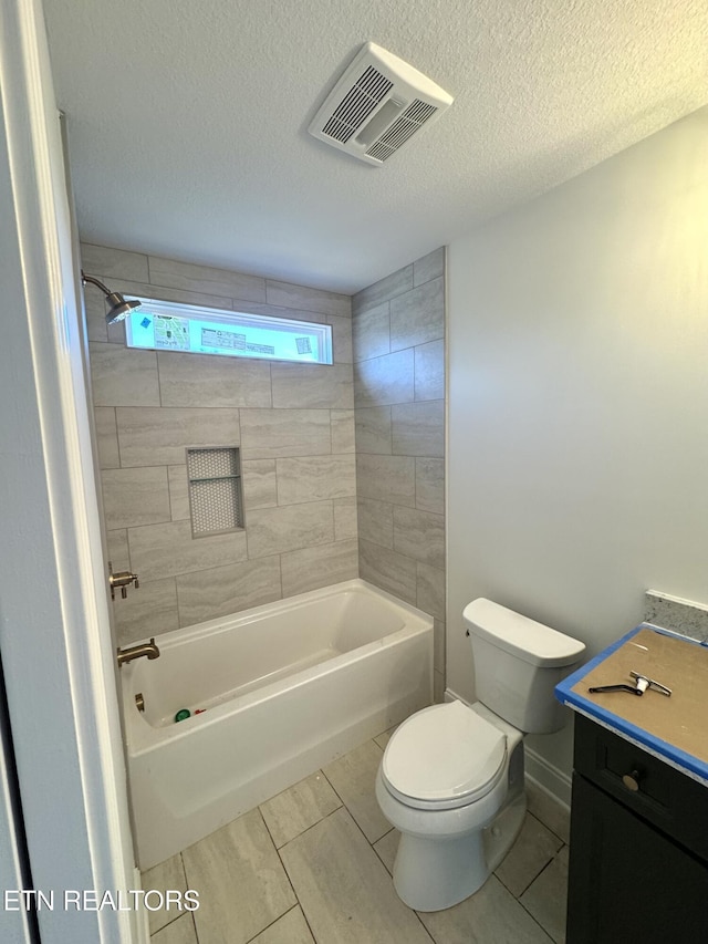 full bathroom with visible vents, toilet, a textured ceiling, bathtub / shower combination, and vanity