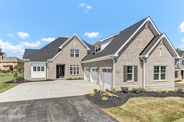 11707 Grigsby Chapel Rd, Knoxville, TN 37934 - view of front of property with brick siding, driveway, a shingled roof, an attached garage, and a front yard