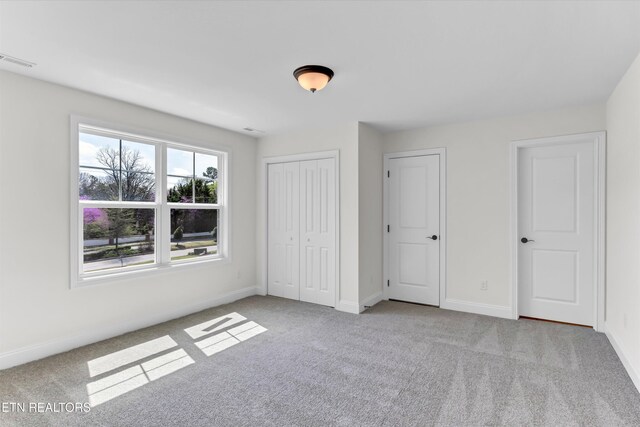 11707 Grigsby Chapel Rd, Knoxville, TN 37934 - unfurnished bedroom featuring carpet, baseboards, and a closet