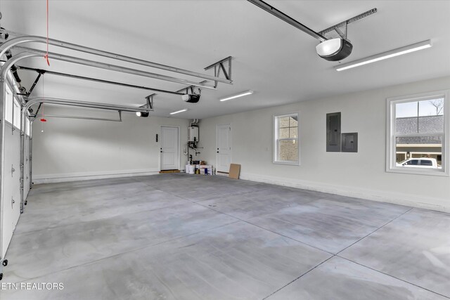11707 Grigsby Chapel Rd, Knoxville, TN 37934 - garage featuring electric panel, a garage door opener, and water heater