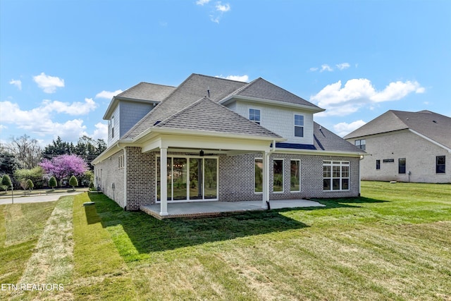 11707 Grigsby Chapel Rd, Knoxville, TN 37934 - rear view of property featuring a patio, brick siding, a lawn, ceiling fan, and roof with shingles