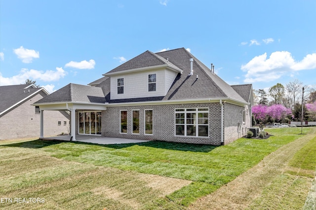 11707 Grigsby Chapel Rd, Knoxville, TN 37934 - rear view of property with a patio, brick siding, a shingled roof, and a lawn