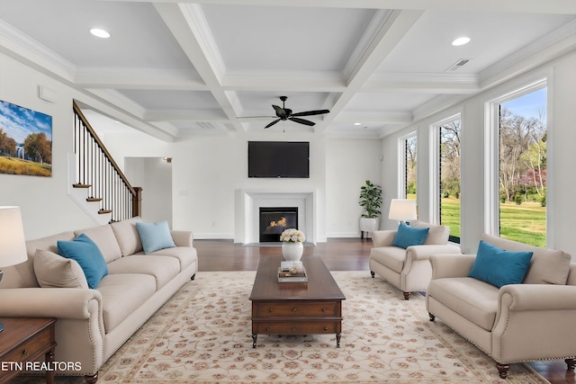 11707 Grigsby Chapel Rd, Knoxville, TN 37934 - living area with beamed ceiling, a ceiling fan, wood finished floors, coffered ceiling, and a fireplace with flush hearth