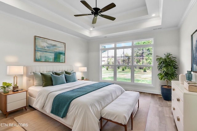 11707 Grigsby Chapel Rd, Knoxville, TN 37934 - bedroom with light wood-style floors, a tray ceiling, ornamental molding, ceiling fan, and recessed lighting