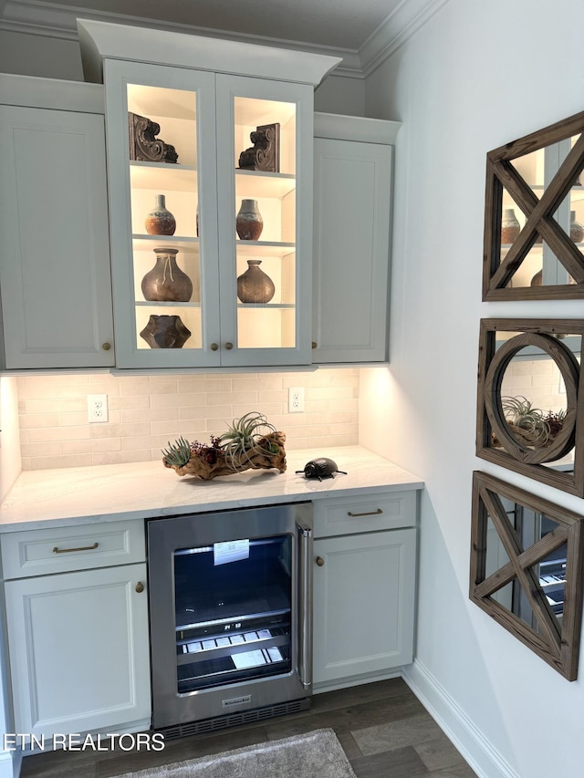 11707 Grigsby Chapel Rd, Knoxville, TN 37934 - bar featuring wine cooler, crown molding, decorative backsplash, dark wood-type flooring, and baseboards