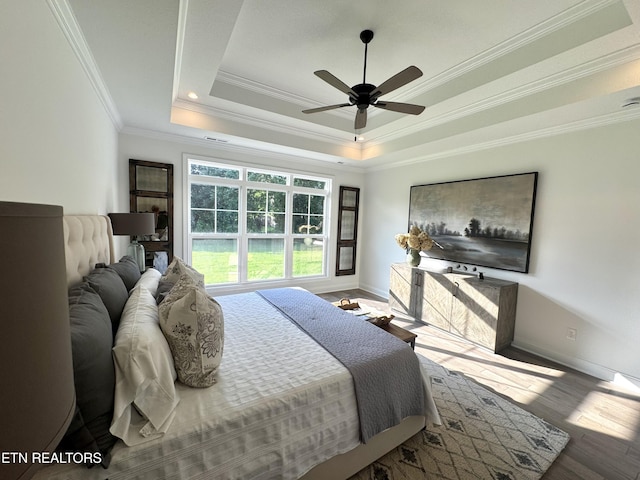 11707 Grigsby Chapel Rd, Knoxville, TN 37934 - bedroom featuring crown molding, wood finished floors, a raised ceiling, baseboards, and a ceiling fan