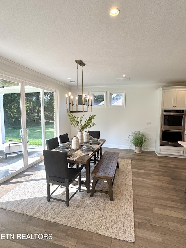 11707 Grigsby Chapel Rd, Knoxville, TN 37934 - dining room featuring ornamental molding, a textured ceiling, healthy amount of natural light, a chandelier, and baseboards