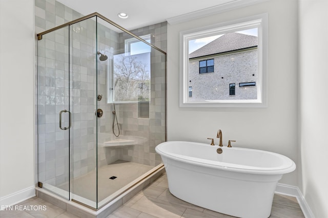 11707 Grigsby Chapel Rd, Knoxville, TN 37934 - bathroom featuring a soaking tub, a shower stall, and baseboards