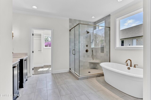 11707 Grigsby Chapel Rd, Knoxville, TN 37934 - bathroom with a freestanding tub, a stall shower, vanity, ornamental molding, and tile patterned floors