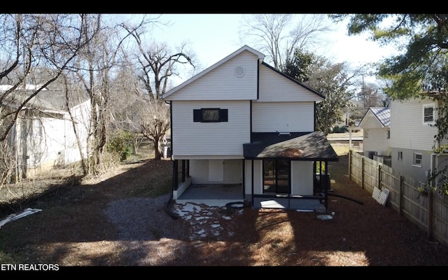 back of property with a patio