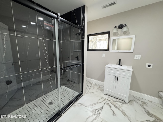 bathroom with vanity and an enclosed shower