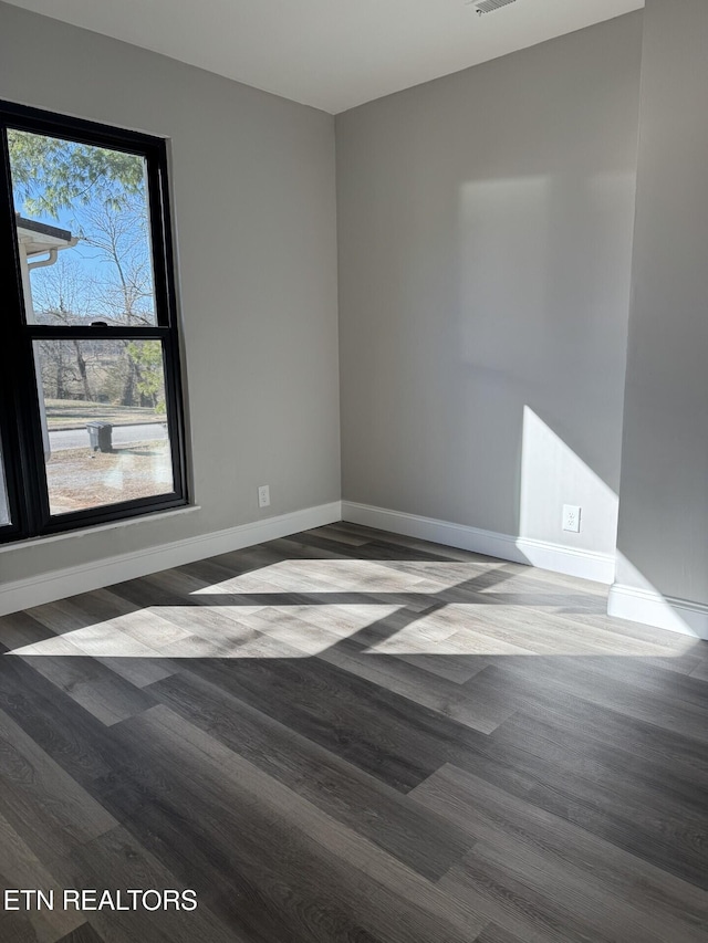 empty room featuring hardwood / wood-style floors