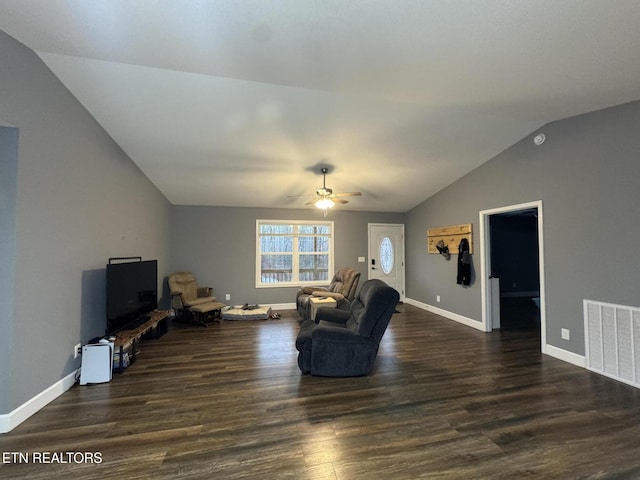 living room featuring lofted ceiling, dark wood-type flooring, and ceiling fan