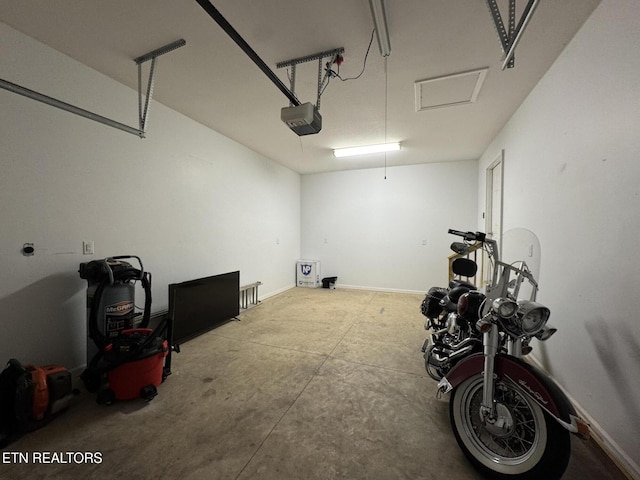 garage featuring a garage door opener