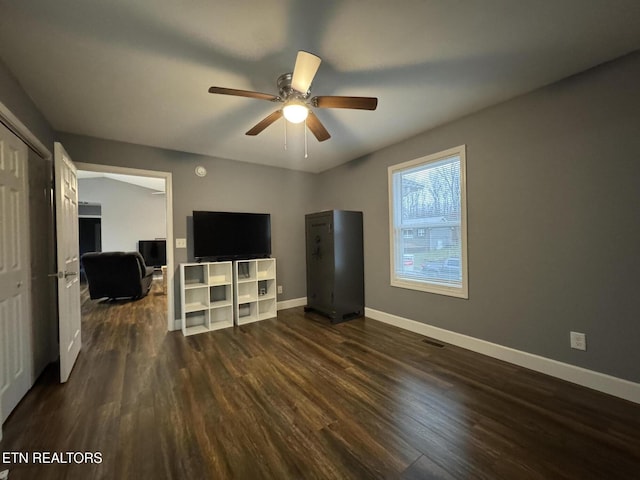 interior space with dark hardwood / wood-style floors and ceiling fan