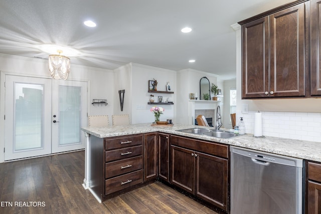 kitchen featuring dishwasher, sink, dark hardwood / wood-style floors, and kitchen peninsula