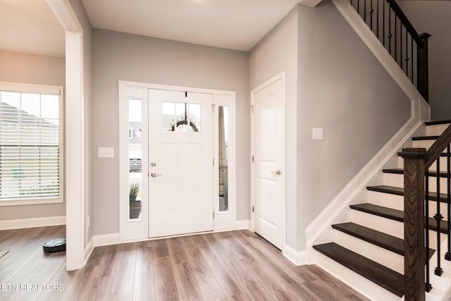 entryway with hardwood / wood-style flooring