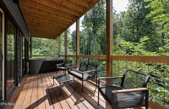 sunroom featuring wood ceiling