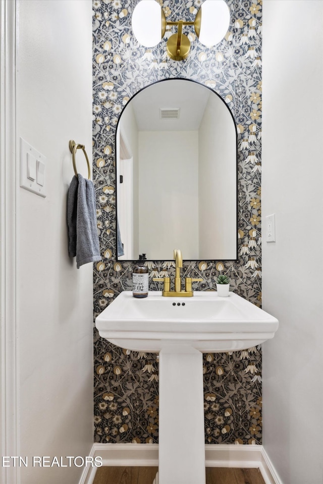 bathroom featuring wood-type flooring