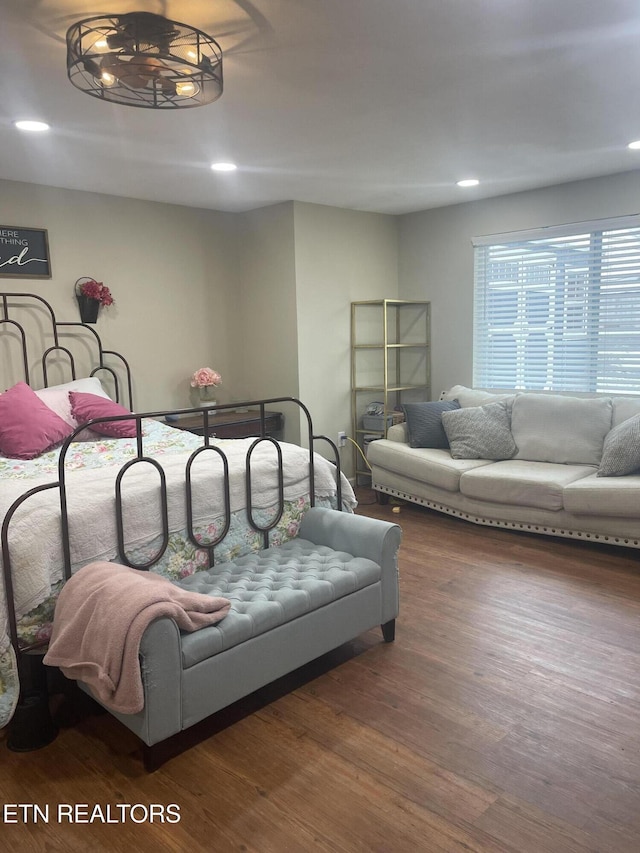 bedroom with dark wood-type flooring