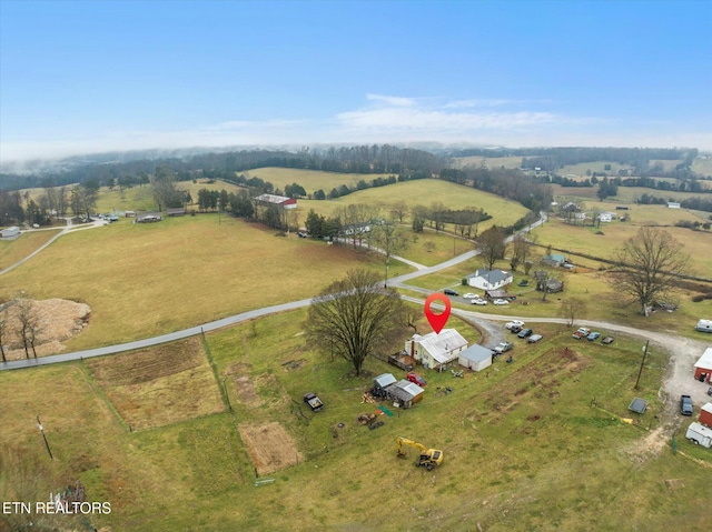 birds eye view of property with a rural view