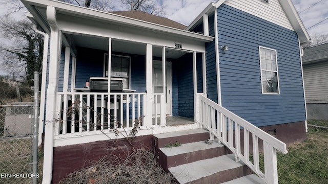 doorway to property featuring a porch