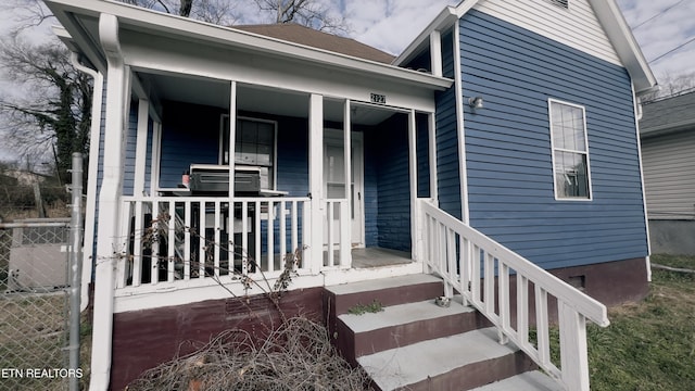 entrance to property with covered porch