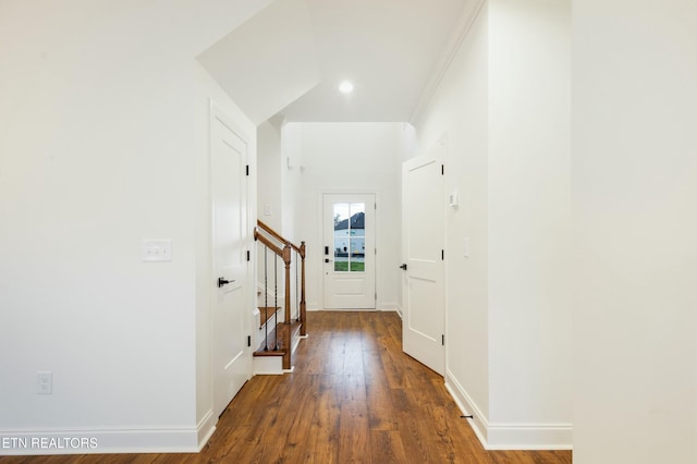 doorway to outside with stairs, baseboards, and dark wood-type flooring