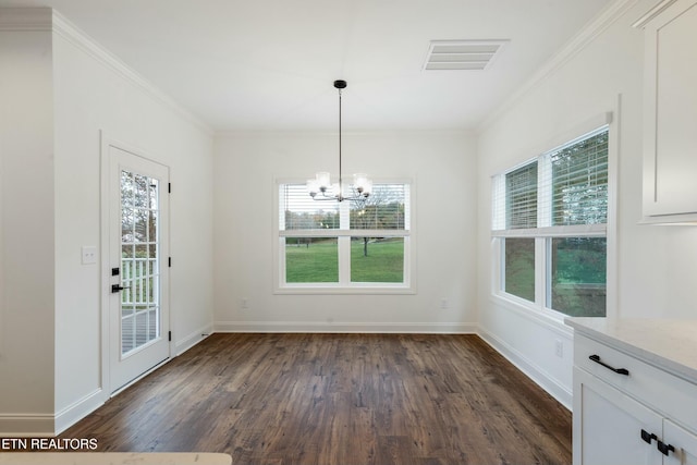 unfurnished dining area featuring a wealth of natural light, visible vents, dark wood-style flooring, and ornamental molding