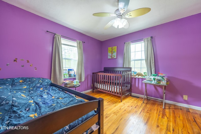 437 County Road 267, Niota, TN 37826 - bedroom with wood-type flooring, baseboards, and ceiling fan