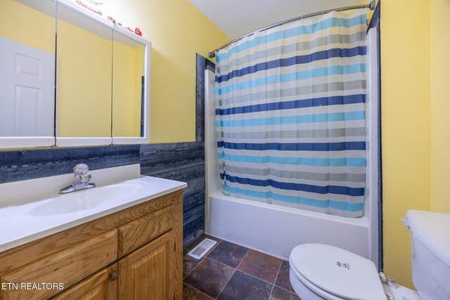 437 County Road 267, Niota, TN 37826 - full bathroom featuring toilet, visible vents, vanity, shower / bath combination with curtain, and stone tile flooring