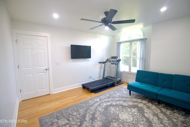 workout room featuring wood finished floors, baseboards, a ceiling fan, and recessed lighting