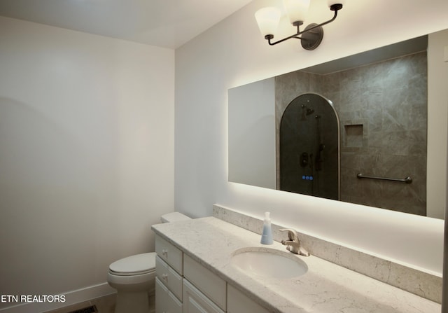 217 Sandpiper Loop, Crossville, TN 38555 - bathroom featuring vanity, toilet, a shower, and baseboards