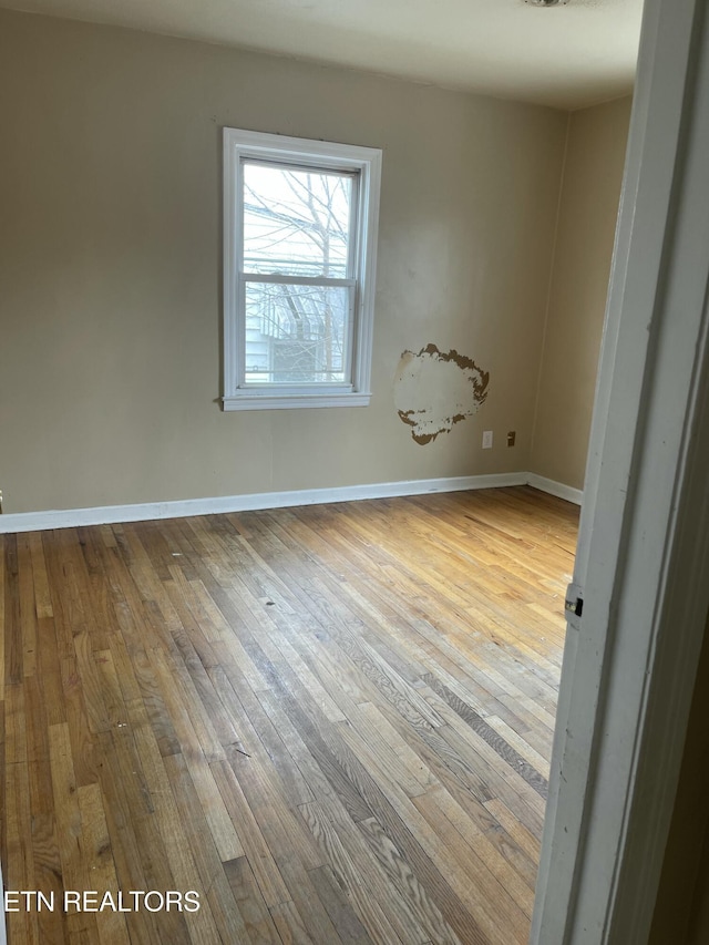 unfurnished room featuring light hardwood / wood-style floors