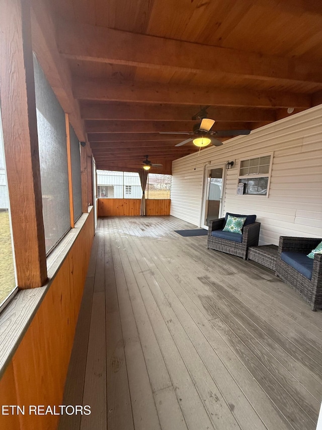 wooden deck featuring ceiling fan