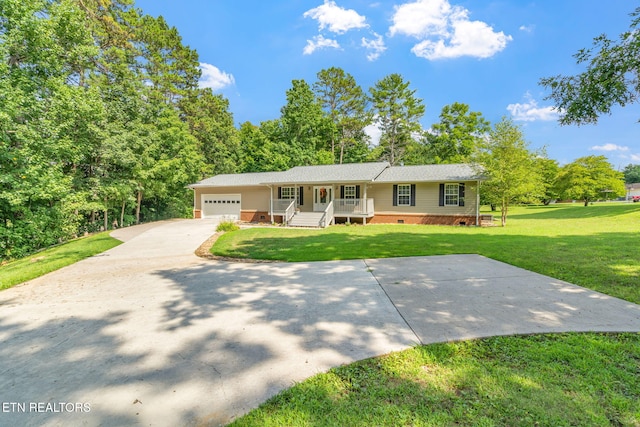 single story home featuring a porch, an attached garage, concrete driveway, crawl space, and a front yard