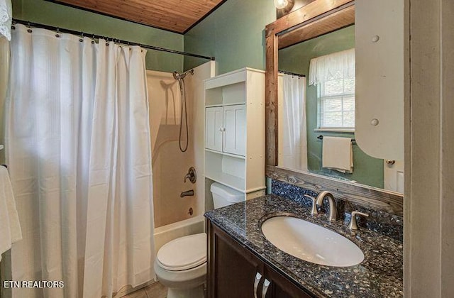 full bathroom with shower / tub combo with curtain, vanity, toilet, and tile patterned floors