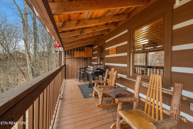 wooden terrace with area for grilling