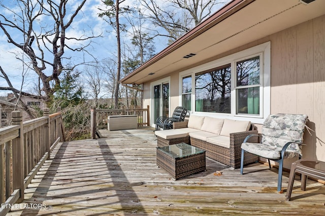 deck featuring outdoor lounge area