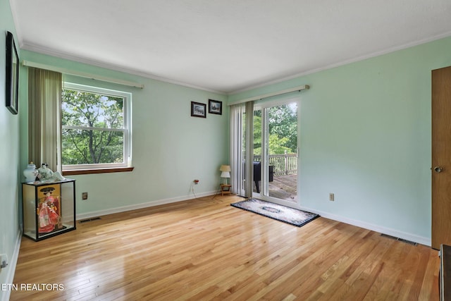 27 Brambleton Ct, Crossville, TN 38558 - empty room featuring crown molding and hardwood / wood-style flooring
