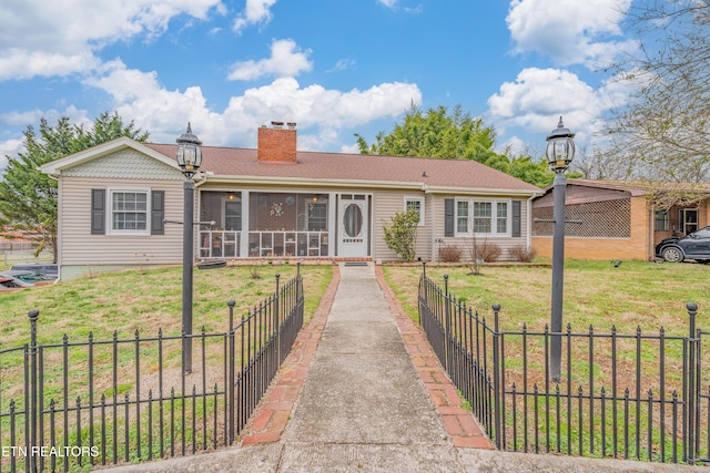 view of front facade with a front lawn