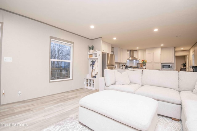 living room featuring recessed lighting and light wood finished floors