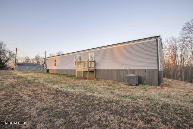 rear view of house with central air condition unit