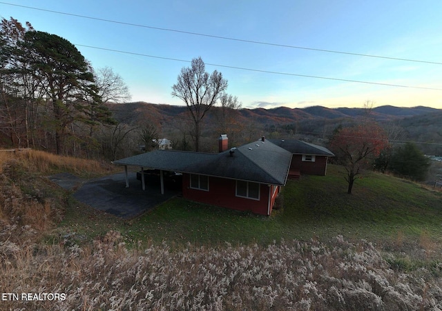 back house at dusk with a mountain view