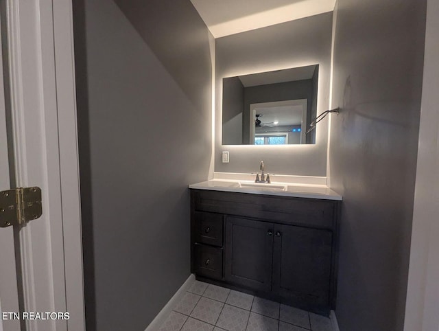 bathroom featuring tile patterned flooring and vanity